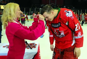 Cardiff Devils forward Joey Haddad collects his winners medal after winning the Elite Ice Hockey League playoff championship in April.
