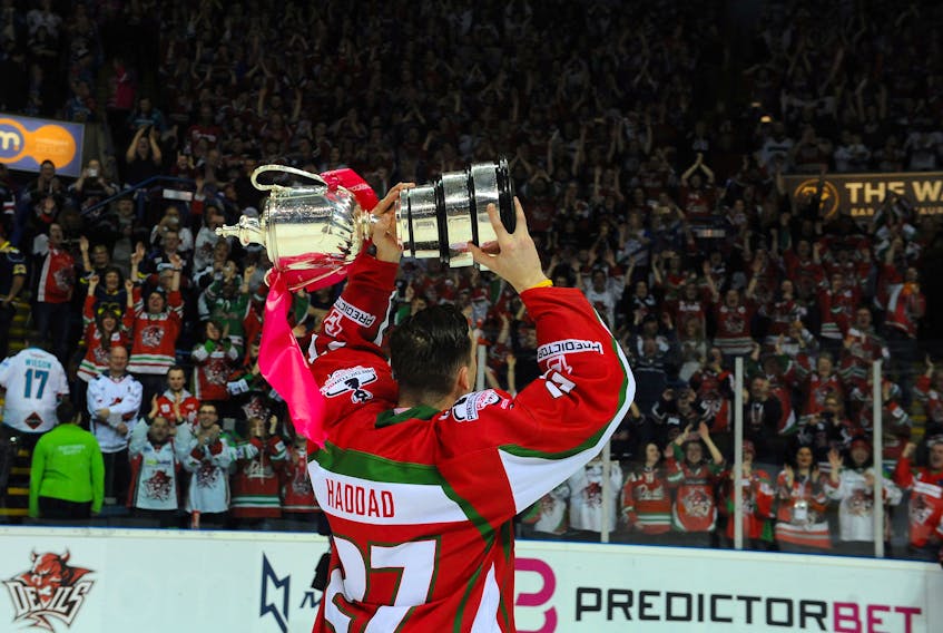 Cardiff Devils forward Joey Haddad lifts the playoff trophy in front of the hundreds of Devils fans at the Nottingham Arena in April of this year. It was the first playoff championship for Cardiff since 1999.