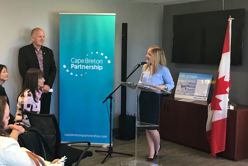 Carla Arsenault, CEO of the Cape Breton Partnership, speaks during an event announcing the Cape Breton Partnership will receive $297,700 in federal funding for a project addressing barriers to women’s entrepreneurship. To the left is Sydney-Victoria MP Mark Eyking, who announced the funding.