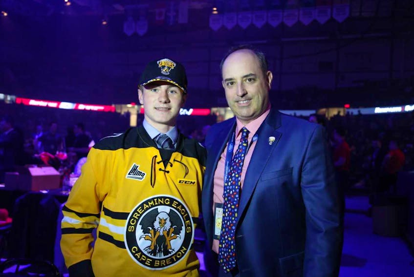 Brady Hunter, a ninth-round pick of the Cape Breton Screaming Eagles last June, is leading the Nova Scotia Eastlink Major Midget Hockey League in points with 17 goals and 25 assists for 42 points in 27 games. Hunter, left, is joined in the picture by Screaming Eagles head coach and general manager Marc-André Dumont.