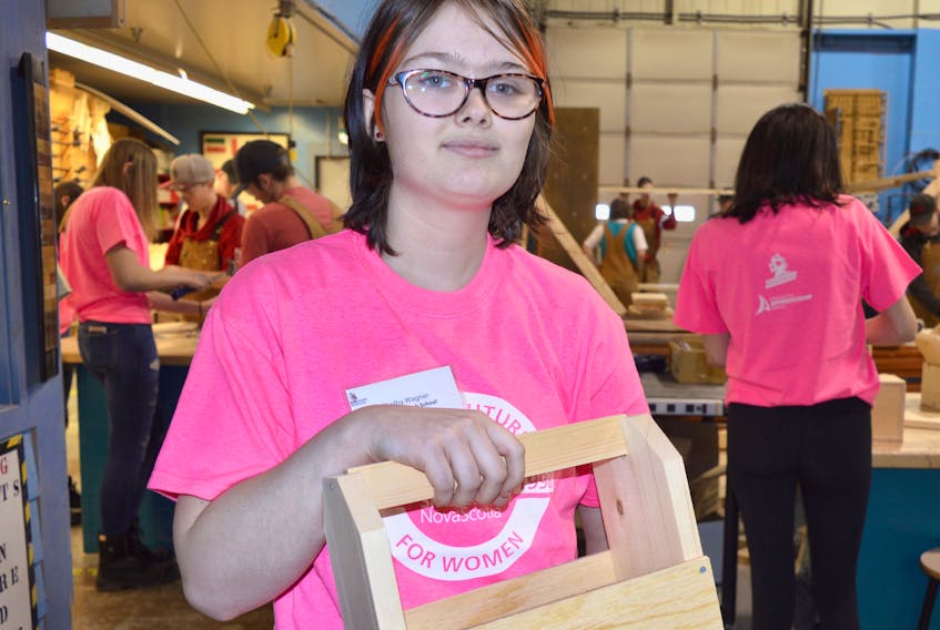 Shelby Wagner, 14, a Grade 9 student at Riverview, shows a toolbox that she made during a Skilled Futures session held at Memorial High in North Sydney on Tuesday.