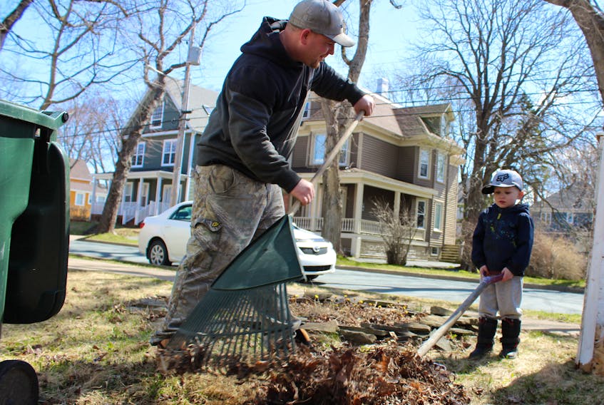 A sure sign of spring is yard work and that’s exactly what Scott MacDonald and his son Avery were found doing Thursday morning. The two spent a portion of their morning picking up leaves and debris from around their Whitney Avenue home.