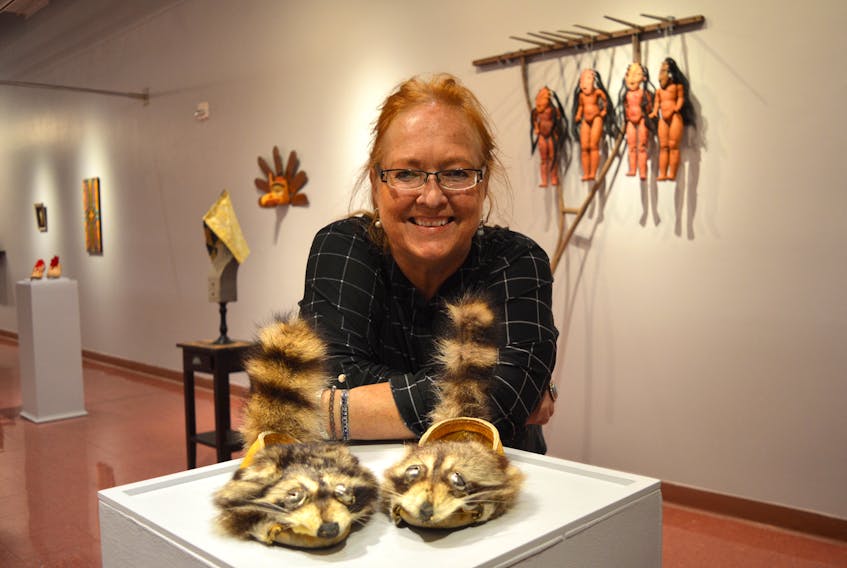 Artist Teresa Marshall stands by some of her works on display at Cape Breton University Art Gallery until January 11.