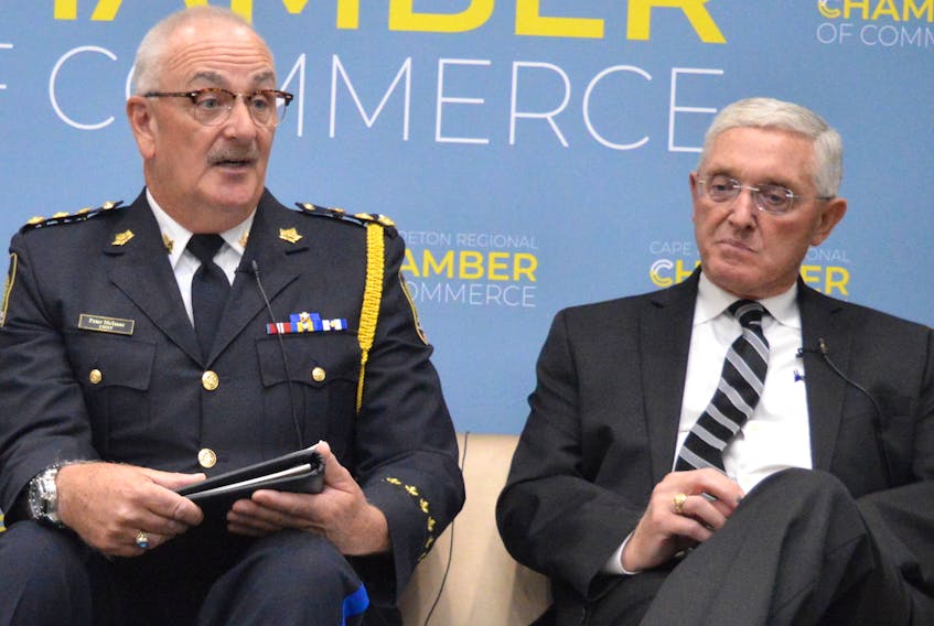 Cape Breton Regional Police Chief Peter McIsaac, left, and lawyer Guy LaFosse took part in a panel discussion on cannabis Tuesday in Sydney.