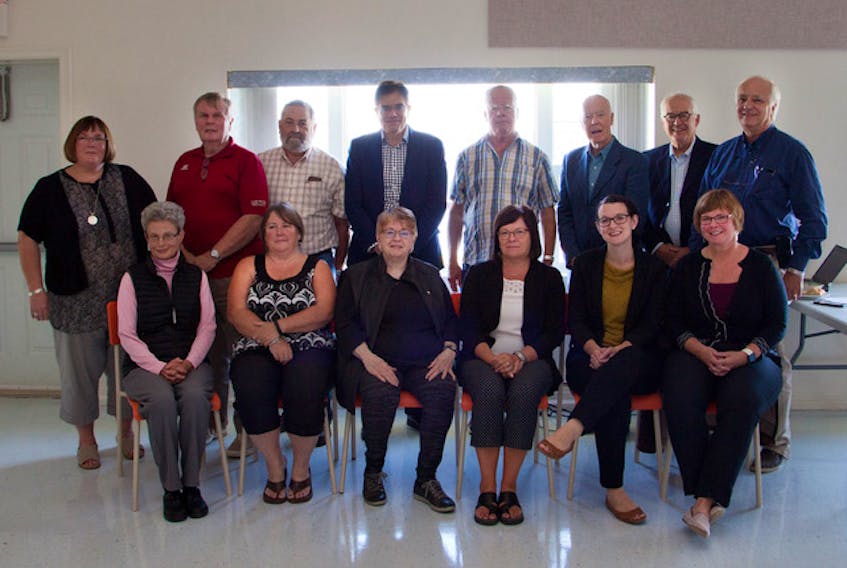 Graduates and several participants and sponsors of the MicroResearch workshop gathered for the project presentation and graduation ceremony on Sept. 21 in the St. Columba Parish Centre in Iona. Shown here, left to right, front row, Dorothy Barnard, River Bourgeois, Juanita MacNeil, Lower Washabuck, Jacquelyn Scott, Ben Eoin, Murdell MacNeil, Iona, Sarah MacDonald, Antigonish and Jill MacMullen, Sydney; back row, Debbie Brennick, Baddeck, Allan Fraser, Ross Ferry, John MacNeil, Iona, George Karaphillis (Dean, CBU Shannon School of Business), Northside East Bay, Hugh C. MacNeil, Iona, Dr. Ron Stewart, North Sydney, Dr. Will Webster and Dr. Bob Bortolussi, Halifax.