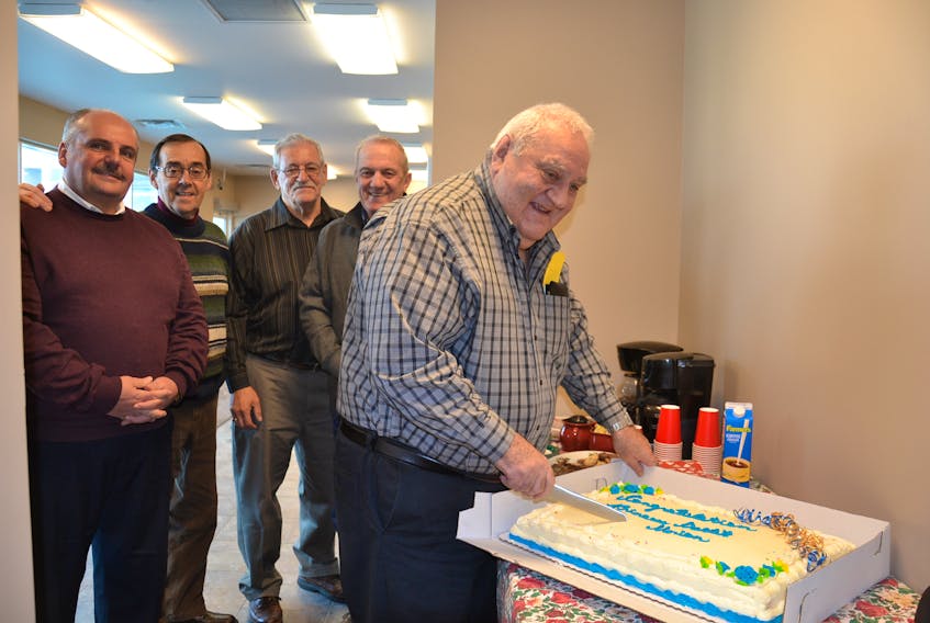 In January 2014, Hector Dipersio, far right, cut the cake at the grand opening of the Princess Credit Union in Sydney Mines. The event was a celebration of renovations to the credit union. Also shown are Brian McGean, manager, Dave Guy, Jack Toomey and Fred Osmond. Dipersio, who died earlier this week, is being remembered for his active community involvement.