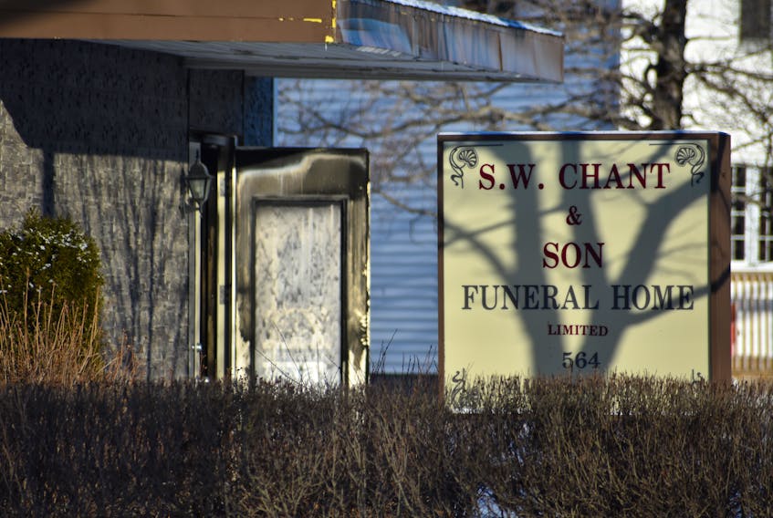 The black-soot covered front door of Chant’s Funeral Home was wide open on Sunday morning to let some of the fumes from Saturday night’s fire out.