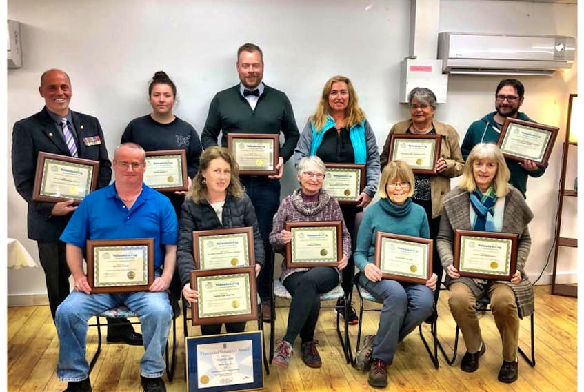 North of Smokey residents honoured for their volunteerism are shown front row, from left, Larry Dauphinee, Andrea Fitzgerald, Linda Murray, Rosemary Algar and Sandra Curtis. Back row, from left, Percy Rasmussen, Jenna Buffett, Emmanuel Comtois, Sheila Fricker, Ruby Fraser and Mike Gorey.