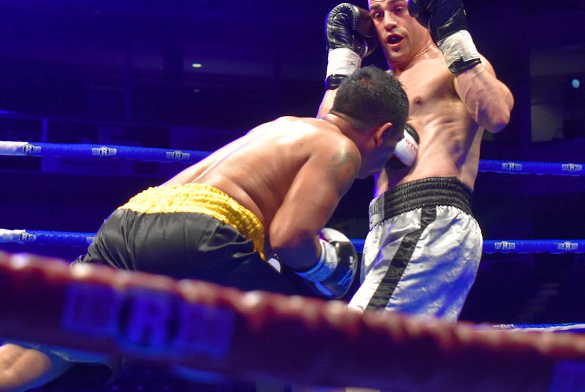 In this file photo, Kyle McNeil, right, of Halifax takes a punch to the stomach area from Jose Saturnino Nava of Mexico during a six-round fight in the lightweight division at Centre 200 on May 19. The Cape Breton Post has learned another professional boxing card will be held at Centre 200 on Nov. 9, headlined by two title matches.