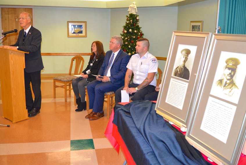 Dr. Ron Stewart talks about his remembrance project at Taigh Na Mara in Glace Bay where portraits of surgeons Dr. Kenneth Angus MacCuish and Dr. Walter Leonard MacLean (on the right) who had practiced in Glace Bay and died while serving in the First World War were unveiled and presented to the veteran’s home and long term care facility. Stewart had been working on the project to recognize the surgeons for about 12 years. Also with Stewart and speaking during the event include, from left, Trish Walsh, resident care manager at Taigh Na Mara, CBRM Mayor Cecil Clarke and Ronald McInnis, an advanced care paramedic with EHS who assisted with the project.