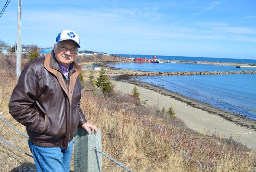 Port Morien Development Association secretary LeRoy Peach stands near the picnic area at Pensioners Point in Port Morien overlooking an area where the bank will be reconfigured and stairs and a landing built for easy access to the beach below. Peach said it's hoped the $100,000 project will be completed by June.