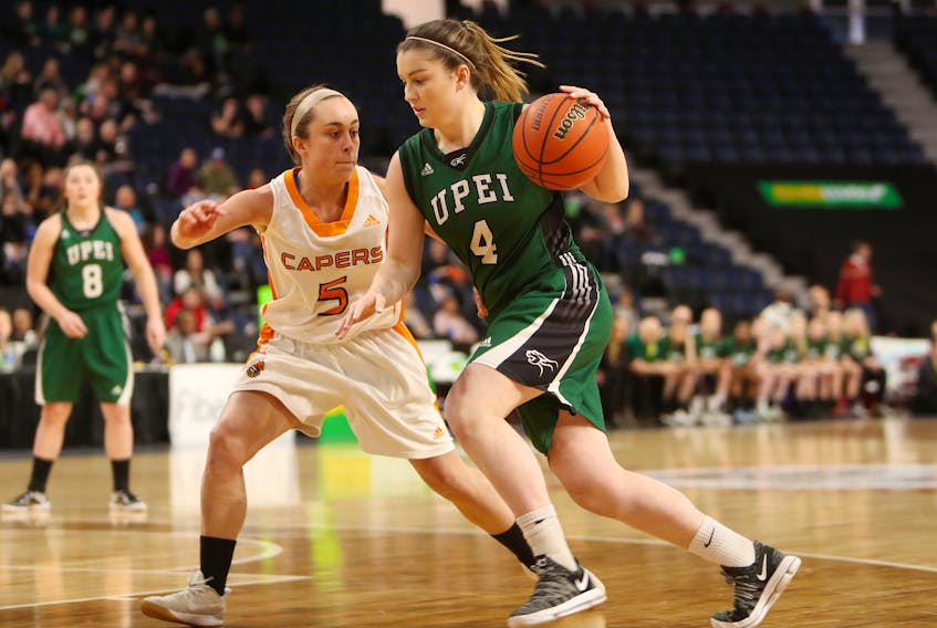 UPEI's Jenna Mae Ellsworth, right, drives toward the hoop as Cape Breton's Toni Bianchini defends during semifinal action between the Panthers and the Capers at the Scotiabank Centre in Halifax on Saturday. The Panthers defeated the defending champion Capers 78-73 to advance to the AUS final against Acadia. The Axewomen defeated UPEI 80-58 to claim the conference championship.