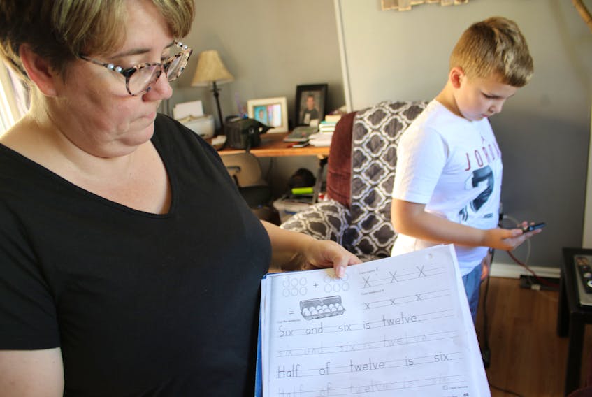 Darlene and Tyler Whalen at their home in Sydney Mines. Frustrated with a long wait list for psychological assessment through the school system, they paid for a private assessment.