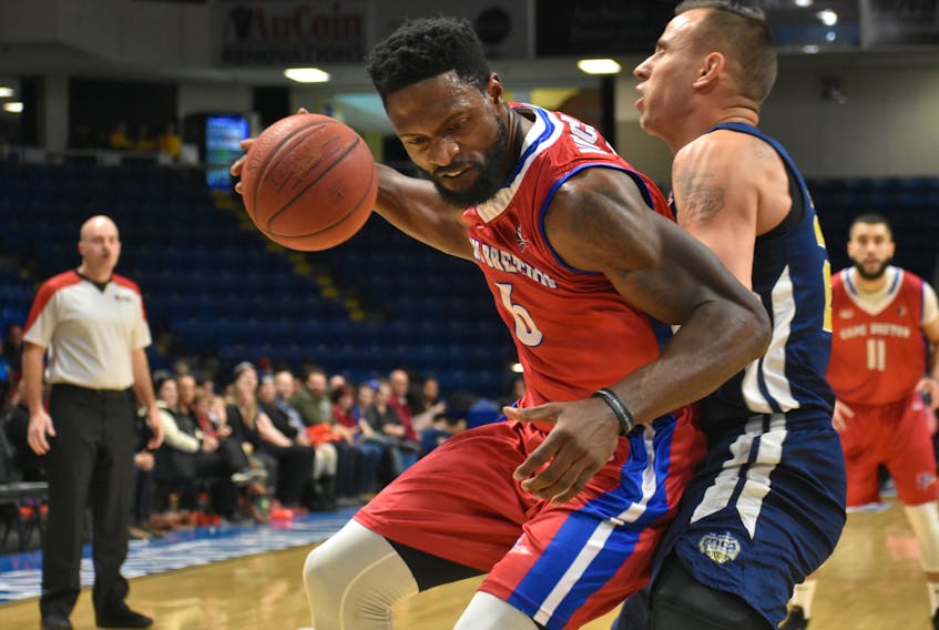 O’Louis McCullough of the Cape Breton Highlanders, left, works his way to the rim while Carl English of the St. John’s Edge attempts to defend during National Basketball League of Canada action at Centre 200 on Tuesday. St. John’s won the game 109-92.