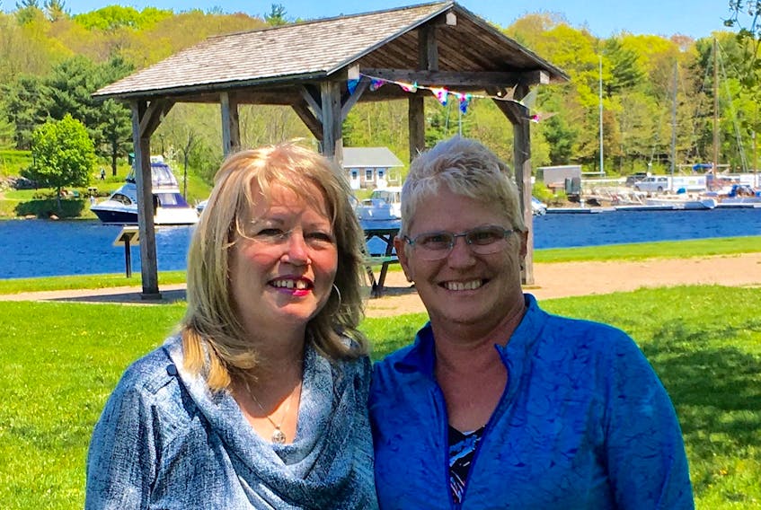 Sydney resident Helen MacCoy, left, and Bridgewater's Linda Finigan recently learned they are half-sisters. The pair has also discovered they share the same father with at least nine other siblings.