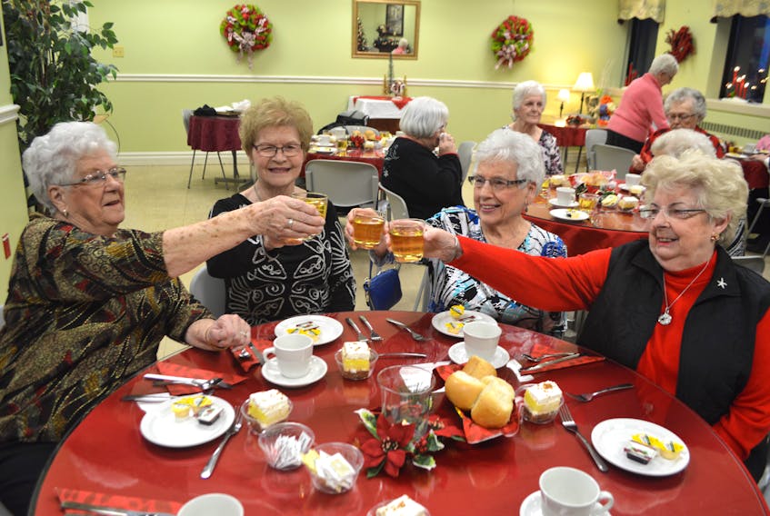 Elizabeth MacDonald, secretary/treasurer of the Glace Bay General Hospital Alumni Association toasts with members, continuing from the left, Jean Courtney, president, Shirley Appleton and Rae MacKillop, vice president, during their last supper before disbanding, at the Glace Bay Hospital Tuesday. MacDonald said after 93 years a decision was made to end the nurse’s association due to a lack of members.