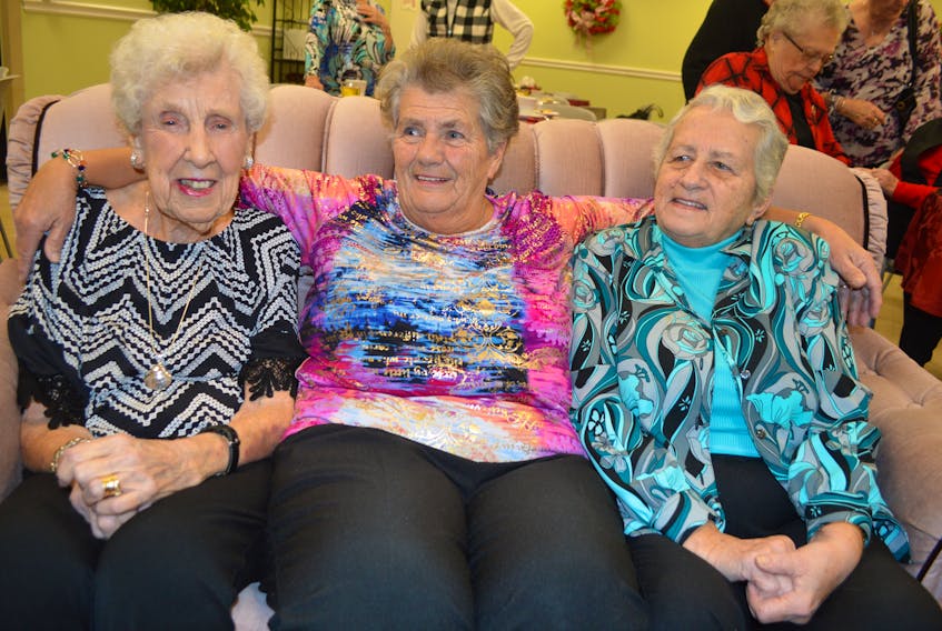 Marguerite Caldwell, left, 99, of Seaview Manor in Glace Bay, a member of the Glace Bay General Hospital Alumni Association, has some fun with other members including (continuing from the left) Helen Grant of Glace Bay and Phyllis MacPherson of Dominion, during a supper the alumni held at the Glace Bay Hospital Tuesday, before disbanding.
