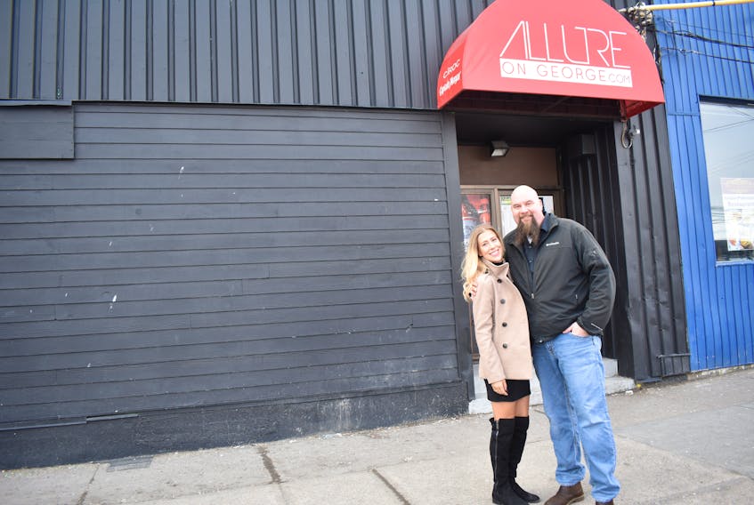 Jessica Strople and Mac Burton stand outside the Allure Nightclub on George Street in Sydney. They are the new owners of the venue which will reopen in April after minor renovations, with a new name and new music format.