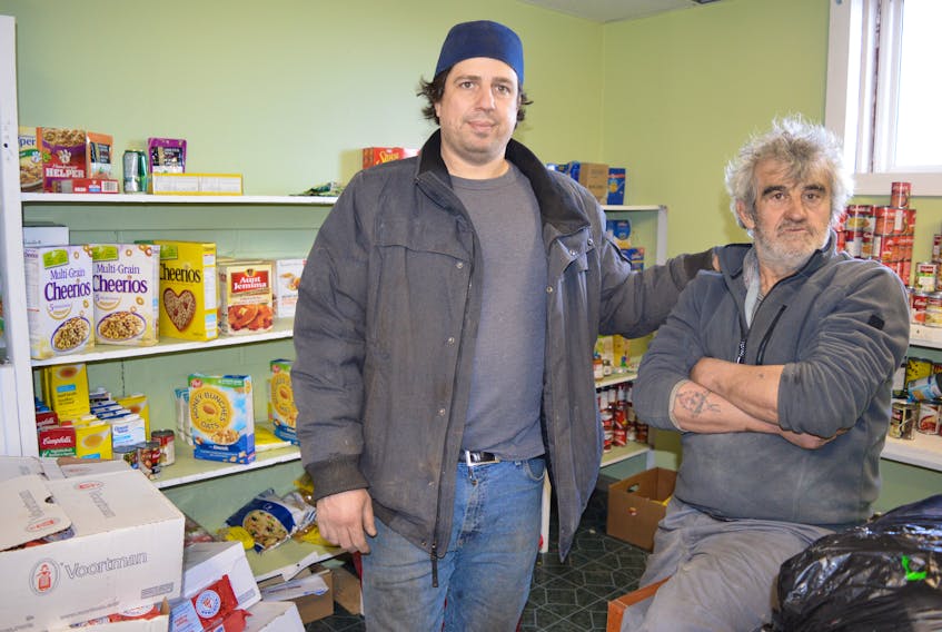 Peter Arapis of the House of Healing in Dominion spends time with client and volunteer John Pratico of Sydney. Arapis said an Easter dinner will be held on April 1 and is open to the public.