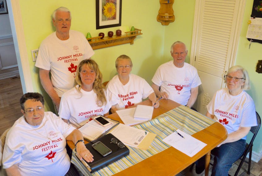 Members of the Johnny Miles Festival Society are shown during a festival meeting at the home of Eugene and Jean Ramsey in Sydney Mines on Tuesday. The annual Johnny Miles Festival will take place this summer after a co-ordinator for the event came forward. From left, Serella Bagnell, Wanda MacKenzie, Martin Pickup, Merdina Bond, Eugene Ramsey and Jean Ramsey.