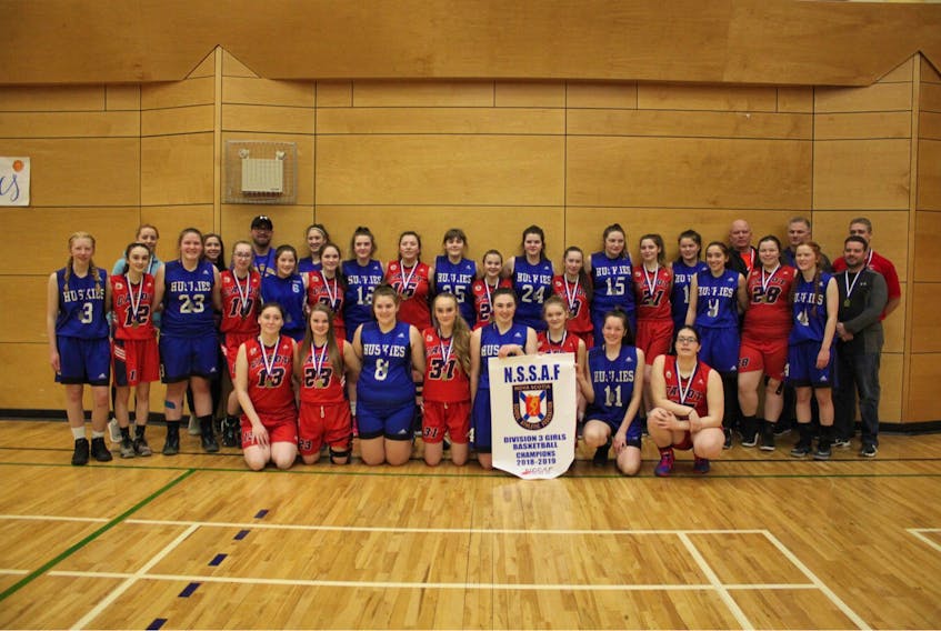 The Cabot Trailblazers and Cape Breton Highlands Academy Huskies made Nova Scotia School Athletic Federation history on Saturday, marking the first time two Cape Breton teams played for a Division 3 girls basketball championship. Front row, from left, Tana Brown, Joni Whitty, Emma MacKinnon, Teah Fricker-MacNeil, Miriam Ingraham-Phillips, Olivia Symes, Abby Morrison and Mackenzie Buchanan. Back row, from left, Emily Ross, Molly Usifer, Kelsey Dixon (Cabot coach), Hannah MacIntosh, Eilidh Ross (Huskies coach), Ali MacKinnon, Billy Crowley (Huskies coach), Ava Ross, Madelyn Whitty, Julia Curley, Jenna Buffett, Abby Morrison, Malery Whitty, Lynn MacKinnon, Abbie Dunphy, Miranda Morrison, Rebecca Barron, Kyla Gale, Sydney Gale, Adam Sams (Cabot coach), Chloe MacKinnon, Shane Hannigan (Huskies coach), Ambrose Dunphy (Cabot coach), Leah Burns and Sarah Ross, Jason Stockley (Cabot coach).