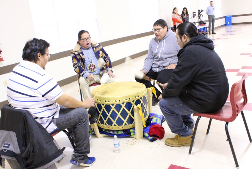 Stoney Bear Singers perform at a settlement engagement session in Eskasoni. The musical group of first cousins say their parents and grandparents were survivors of a government-sponsored Indian residential school in Shubenacadie, N.S. Shown clockwise are Steven Julian, Michael R. Denny, Sulian Denny and Cyril Julian.