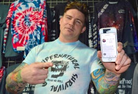 Kent Peters, owner and head instructor of Zombie Proof Brazilian Jiu-Jitsu and Mixed Martial Arts, shows his Instagram account. Peters recently became one of the few people to return from the Instagram graveyard after his account, which has more than 21,800 followers, was deleted. Peters says social media is a key part of promoting his gym, YouTube channel and Supernatural Survival Gear line of grappling apparel seen in the background.