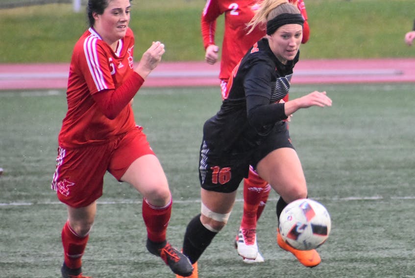 Chelsea Foote of the Cape Breton Capers, right, battles for ball possession with Briana Pender of the Memorial Sea-Hawks during Atlantic University Sport semifinal action at the Cape Breton Health Recreation Complex in Sydney on Nov. 2. The Capers will play in the U Sports Women’s National Championship in Ottawa, Ont., beginning today.
