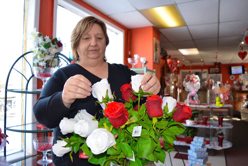 Patricia Hillis, owner of Thoms Flowers in Glace Bay, sets up a flower display at her store. She has recently partnered with the Glace Bay Y’s Men’s and Women’s Club to provide decorating services to anyone renting the club’s gymnasium for a wedding reception.