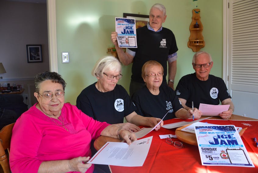 Members of the Johnny Miles Festival Society are shown discussing the upcoming Ice Jam, a fundraiser in support of the annual Johnny Miles Festival, which takes place each year in August. From left, Serella Bagnell, Jean Ramsey, Merdina Bond, Martin Pickup and Eugene Ramsey.
