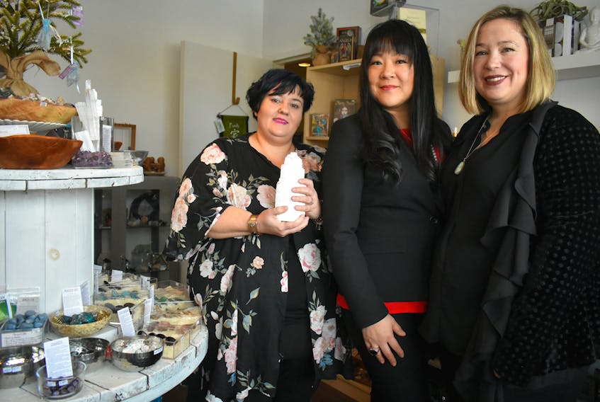 From left, Anita Helle, Lisa Lee and Monica Black at Sage Moon Boutique in North Sydney on Sunday, where they were preparing for their 2019 New Moon Intentions and Beginnings Gathering. The event, which featured meditation, reiki healing and intention (goal) setting, sold-out before the early bird special was over. Every event and workshop they’ve held since launching in September has sold-out.
