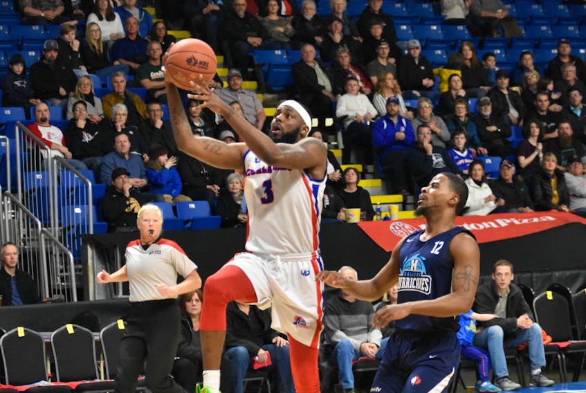 Devin Sweetney, left, scored 11 points for the Cape Breton Highlanders in their 92-89 loss to the Halifax Hurricanes in National Basketball League of Canada playoff action Monday at Centre 200 in Sydney. The Highlanders trail the best-of-five series 2-1.