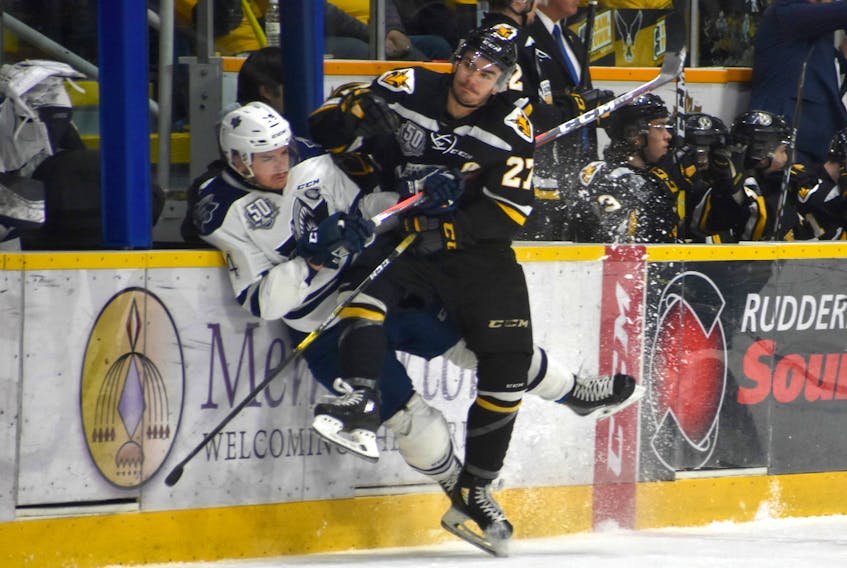 Gabriel Proulx of the Cape Breton Screaming Eagles lays a hit on Charle-Edouard D'Astous of the Rimouski Océanic during Game 3 of their Quebec Major Junior Hockey League quarter-final series on Tuesday at Centre 200.