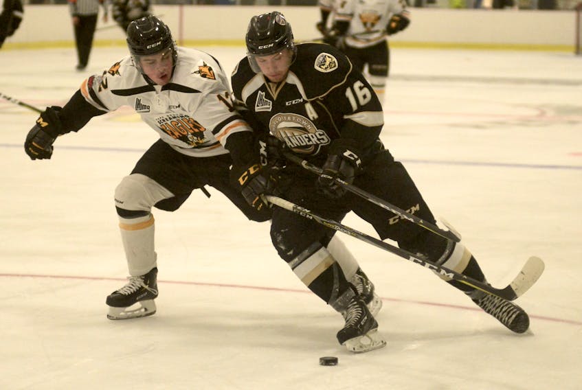 Cape Breton Screaming Eagles defenceman Wilson Forest, left, ties up Charlottetown Islanders forward Keith Getson during a Québec Major Junior Hockey League pre-season game on Sunday in Abram Village, Prince Edward Island. The Islanders won the game 4-1. The Screaming Eagles are now idle until the 2018-2019 season opener on Sept. 21 when they return to P.E.I. to take on the Islanders in Charlottetown. Cape Breton’s home opener is Friday, Sept. 28 when the Screaming Eagles host the rival Halifax Mooseheads at Centre 200.
