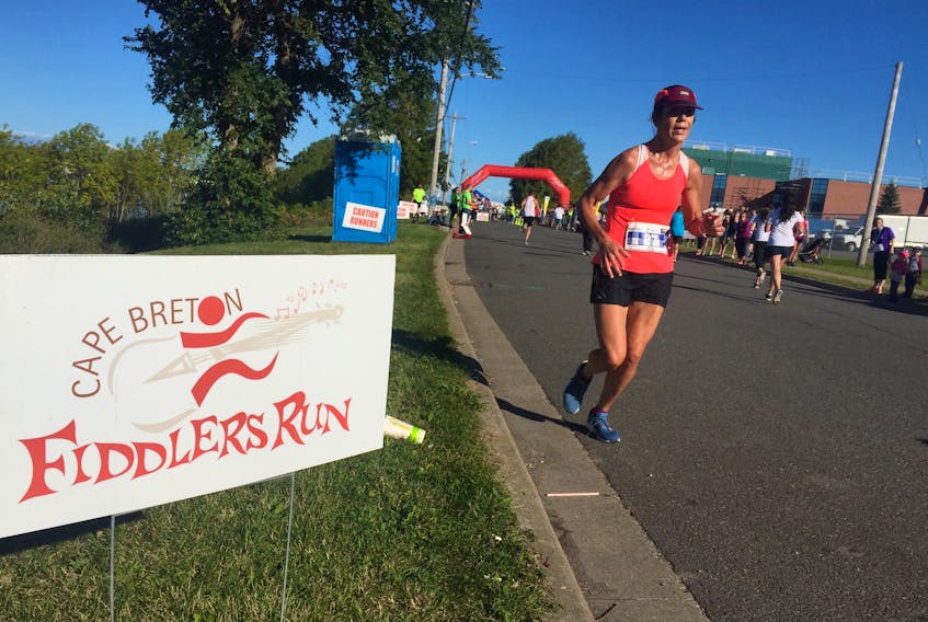 Jen Nicholson, 49, starts the second leg of the full marathon at the Cape Breton Fiddlers Run on Sunday. The Cape Breton native who now lives in Cornwall, P.E.I., was in first place until roughly the turning point of the last lap.