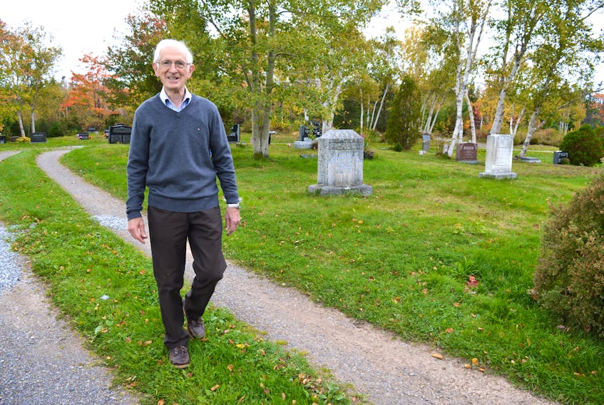 Allister Spencer, treasurer and a trustee for Black Brook Cemetery in Port Morien, is shown walking through the cemetery last fall. Spencer said the cemetery committee is reaching out to lot owners in an effort to update records.