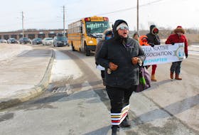 For the first day of Eastern Nova Scotia’s Family Violence Prevention Week on Sunday a march was held in Membertou. Because of the bitter cold and temperatures around -20 C with the wind chill, most people drove or took the bus along the route of about three blocks. Eight people chose to embrace the cold and walked with the banner. This was the fourth year a walk like this was done in Membertou and it was done in conjunction with the Nova Scotia Native Women’s Association, Kwe’jijnaq (Membertou women’s association) and the Strait Area Sexual Violence Prevention and Support Coalition.