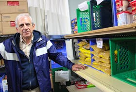 Lawrence Shebib stands inside North Sydney’s community food bank which averages 170 family visits each month.