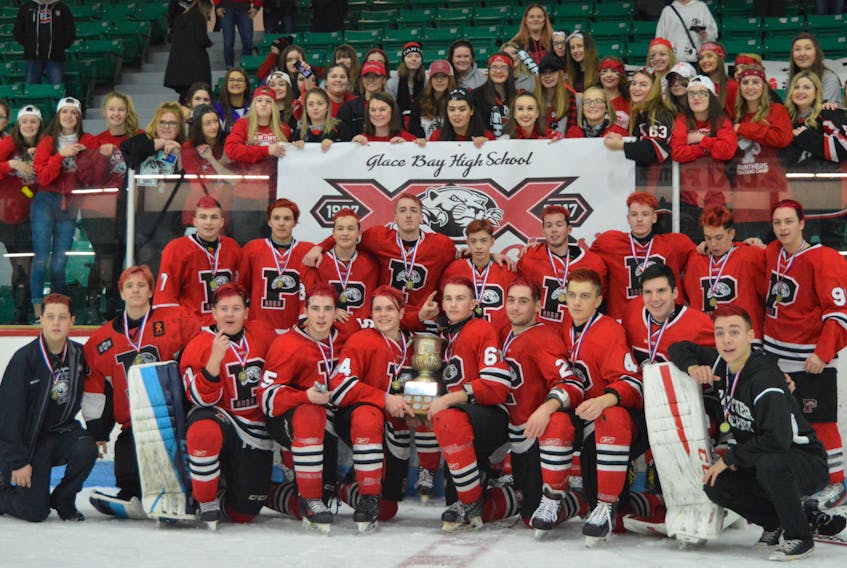 Members of the Glace Bay Panthers pose with supporters after the host team captured the 2017 Panther Classic championship after a thrilling 2-1 overtime victory over the rival Riverview Redmen on Sunday at the Canada Games Complex.