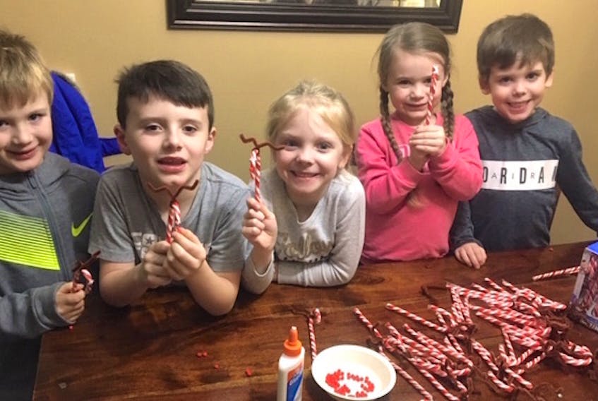Helping prepare candy canes for Wednesday’s dance taking place at the North Sydney fire hall were Bronsen Hickey, from left, Anderson Scott, Gracie Robinson, Vada Scott and Gavin Robinson.