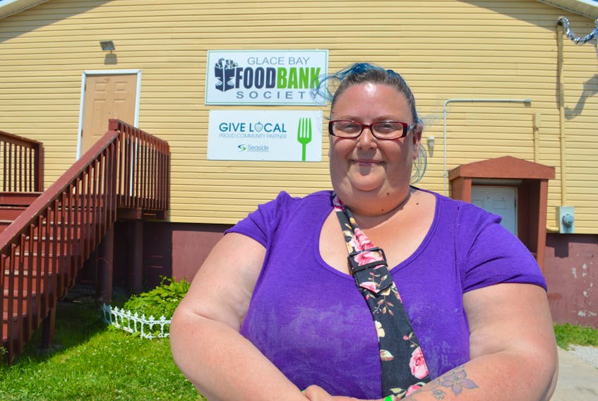 Michelle Kalbhenn, 39, of New Waterford, stands in front of the Glace Bay Food Bank on Hector Street. Kalbhenn has been hired as the new co-ordinator of the food bank, replacing Sandra McPherson, who has retired after 34 years of service.