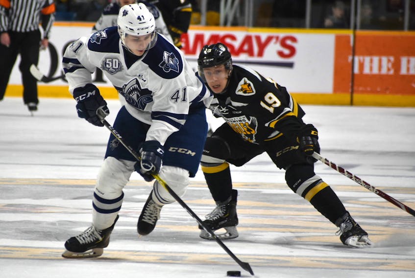 Shaun Miller of the Cape Breton Screaming Eagles, right, pressures Radim Salda of the Rimouski Océanic during Game 4 of the Quebec Major Junior Hockey League quarter-final series at Centre 200 on Thursday.