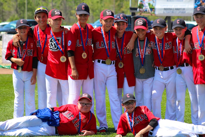 Members of the Glace Bay McDonald’s Colonels pose after the championship game of the 2018 Canadian Little League Championship (ages 11-12) that wrapped up Saturday in Mirabel, Que.