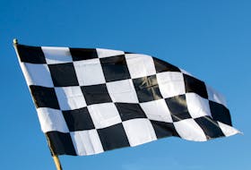 A checkered flag is seen in this stock image.