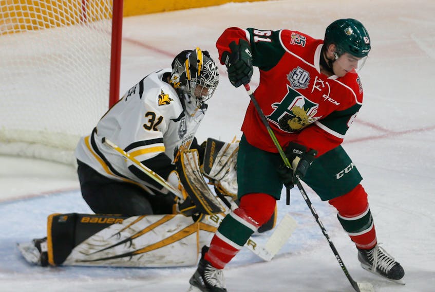 Joel Bishop of the Halifax Mooseheads tips a shot wide in front of Cape Breton Screaming Eagles goalie Kevin Mandolese during QMJHL action in Halifax on Wednesday. Cape Breton won the game in a shootout, 3-2.