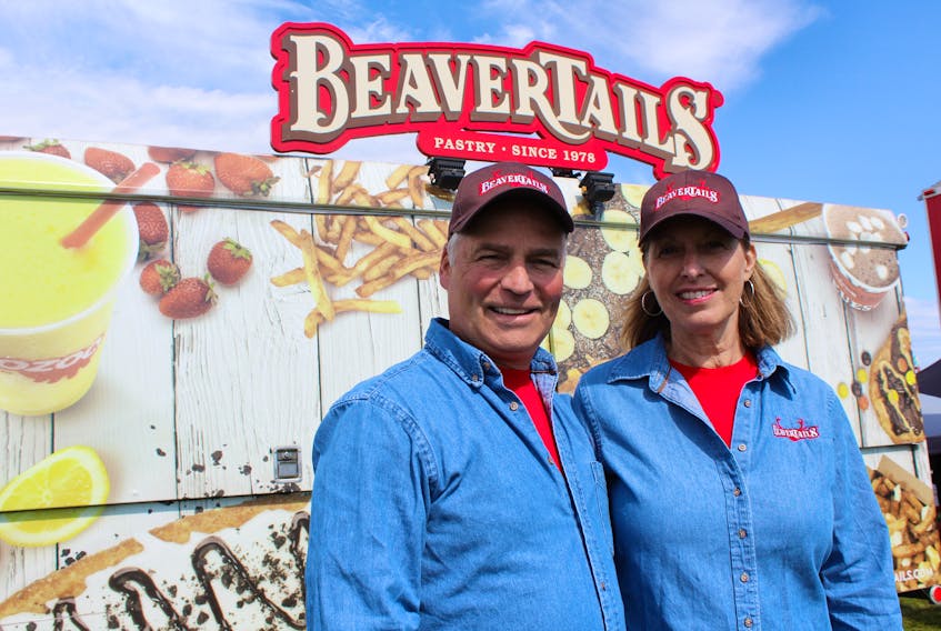Bob and Karen Walker stand in front of their mobile BeaverTails trailer at Open Hearth Park in Sydney, Thursday. The pastry and poutine franchise is relatively new to the palate of Cape Bretoners. The Walkers recently purchased the rights to the franchise for all of Cape Breton Island.