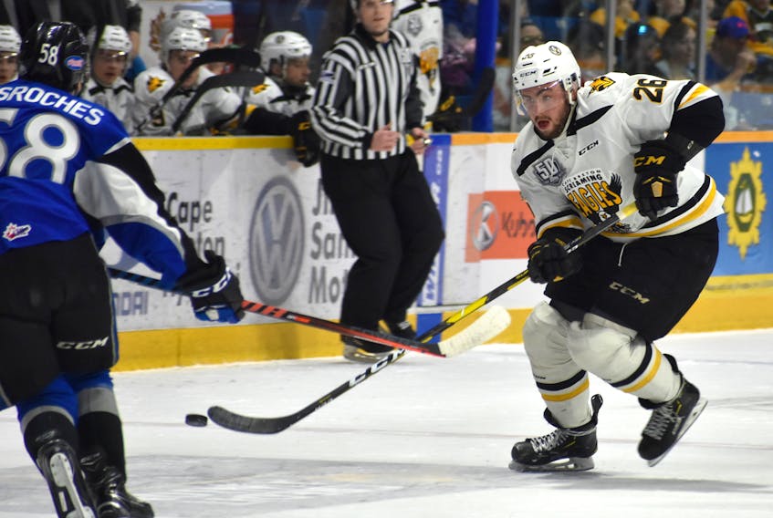 Egor Sokolov of the Cape Breton Screaming Eagles chips the puck into the Saint John Sea Dogs zone during the first period of Quebec Major Junior Hockey League action Wednesday at Centre 200. Cape Breton won the game, 5-3.