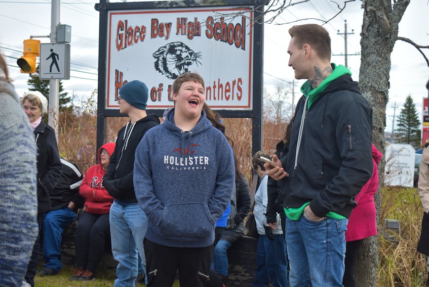 Brett Corbett shares a laugh with champion boxer Ryan Rozicki before the rally started on Tuesday. Rozicki had reached out to the family, offering his support to helping the family spread the message bullying needs to stop.