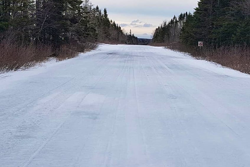 In this recent picture, Main Highland Road, which connects Hunters Mountain to Wreck Cove, is shown with only a light covering of snow. Sheldon Garland, president of Crowdis Mountain Snowmobile Club, says he would expect the road to have five to six feet of snow on it at this time of year.