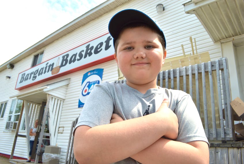 Jesse Young, 9, of New Waterford, stands in front of the Bargain Basket on King Street in New Waterford. The young boy found a wallet by the door of the store and turned it over to staff before it ultimately found its way back to the owner.